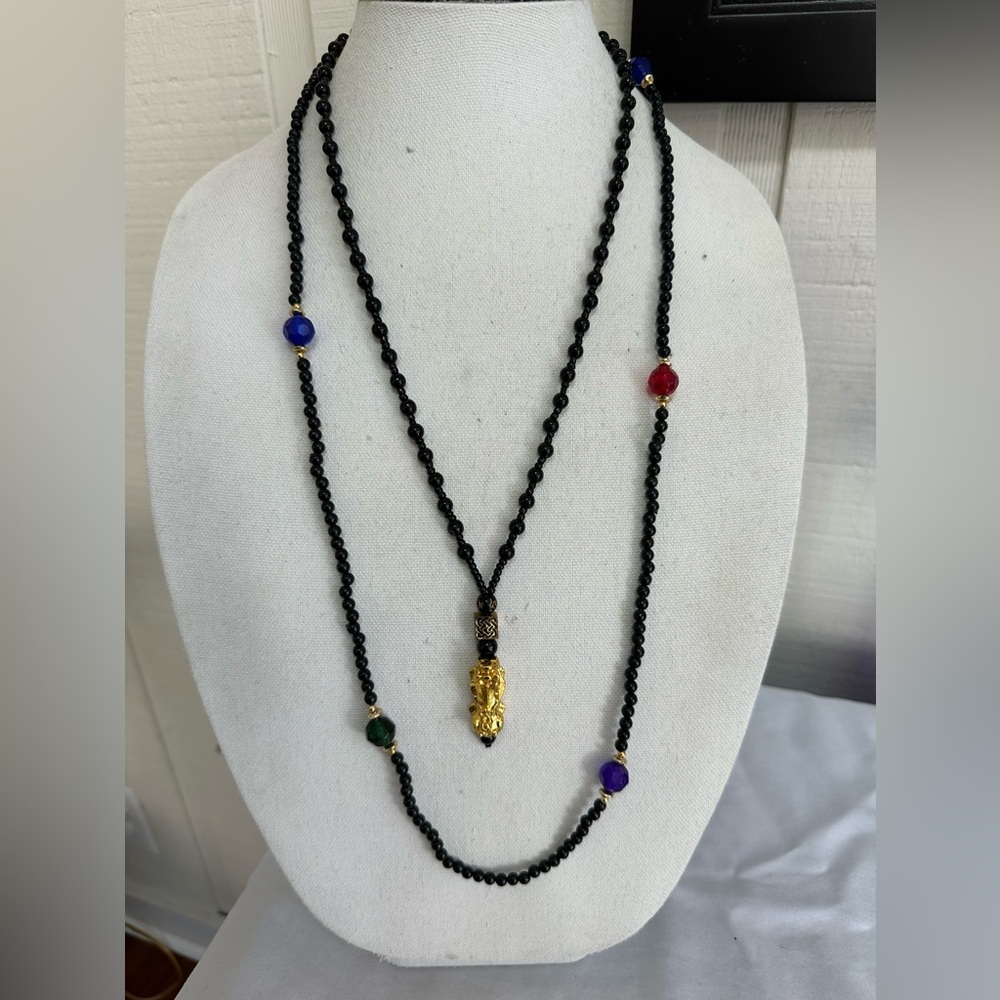 Two black bead necklaces with goldtone accents